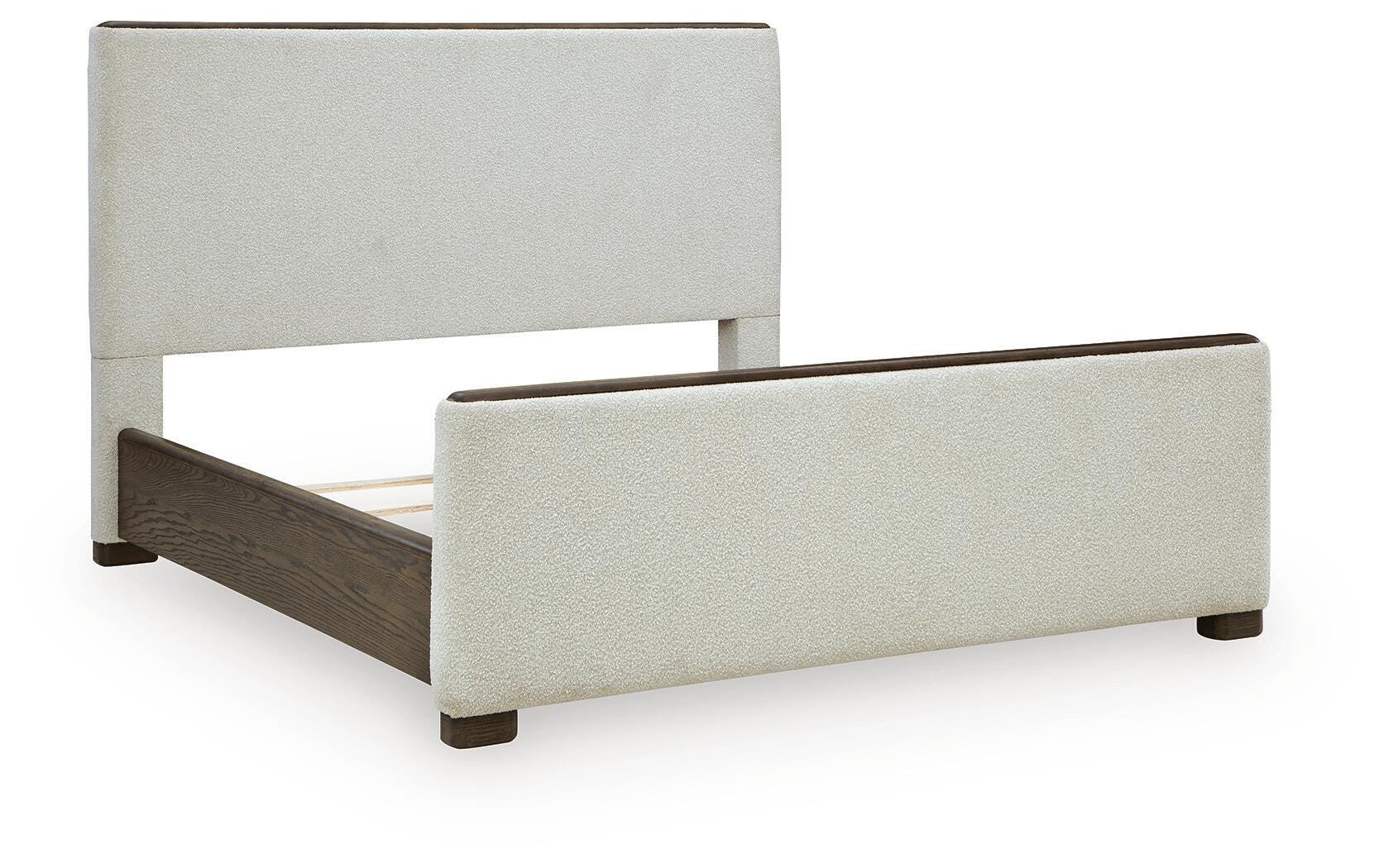 Radkin Burnished Brown Queen Upholstered Panel Bed angled view