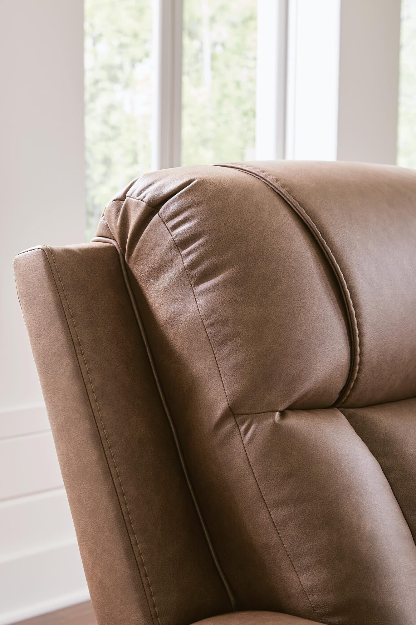 Mackmenville Caramel Faux Leather Recliner detail view