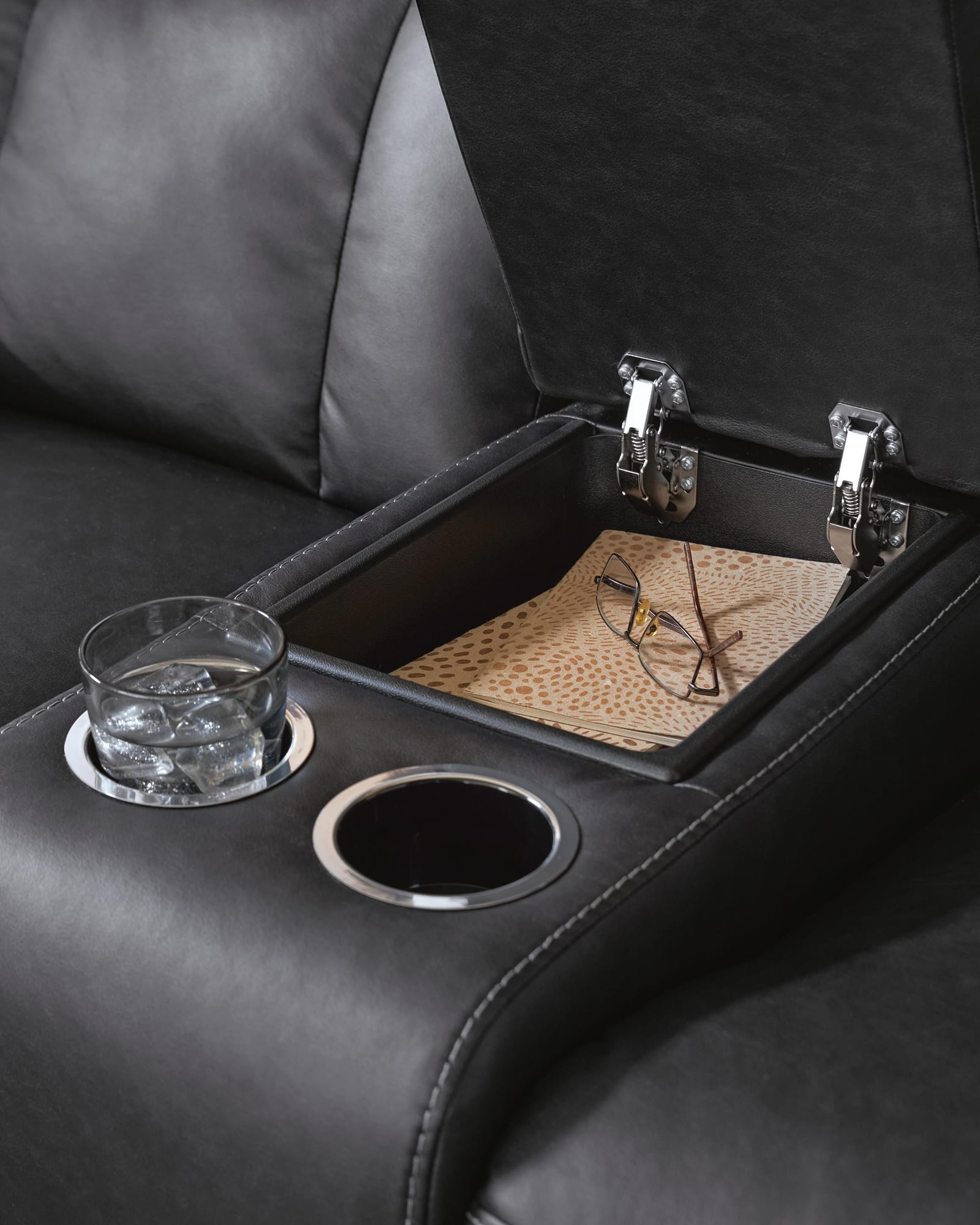 Mackmenville Carbon Faux Leather Reclining Loveseat with Console from Ella Furniture
