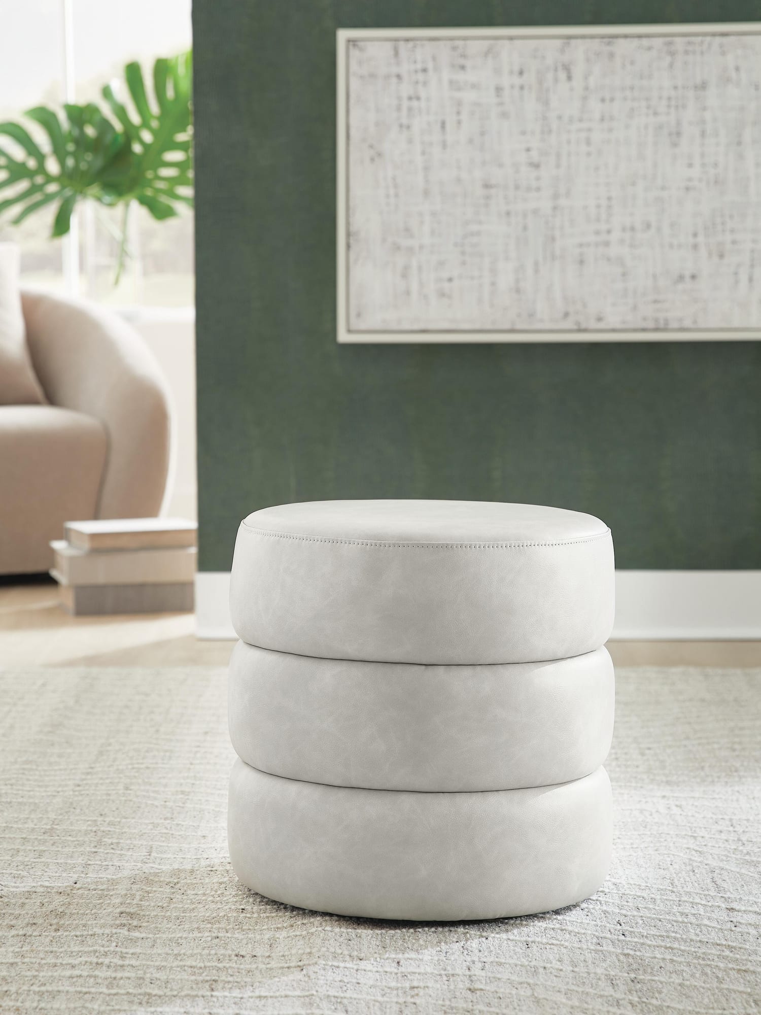 Ummi Bone Swivel Accent Ottoman from Ella Furniture