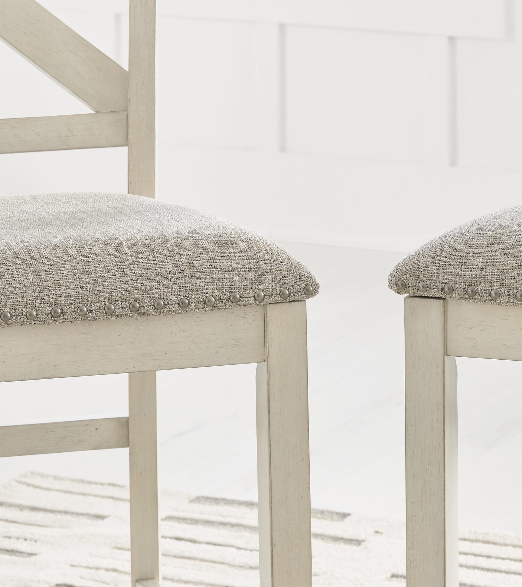 Robbinsdale Antique White Counter Height Barstool detail view