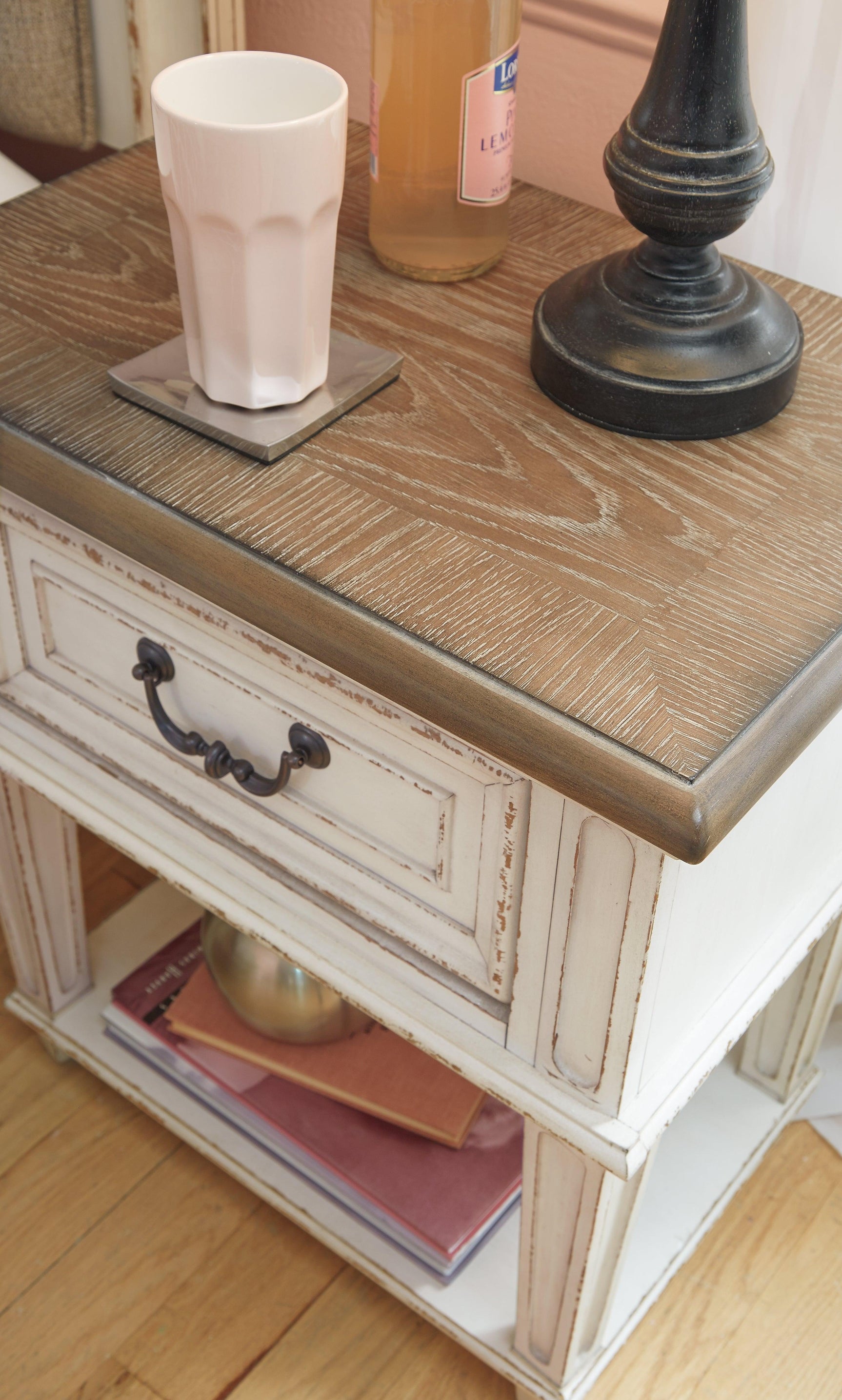 Realyn Chipped White Nightstand - Ella Furniture