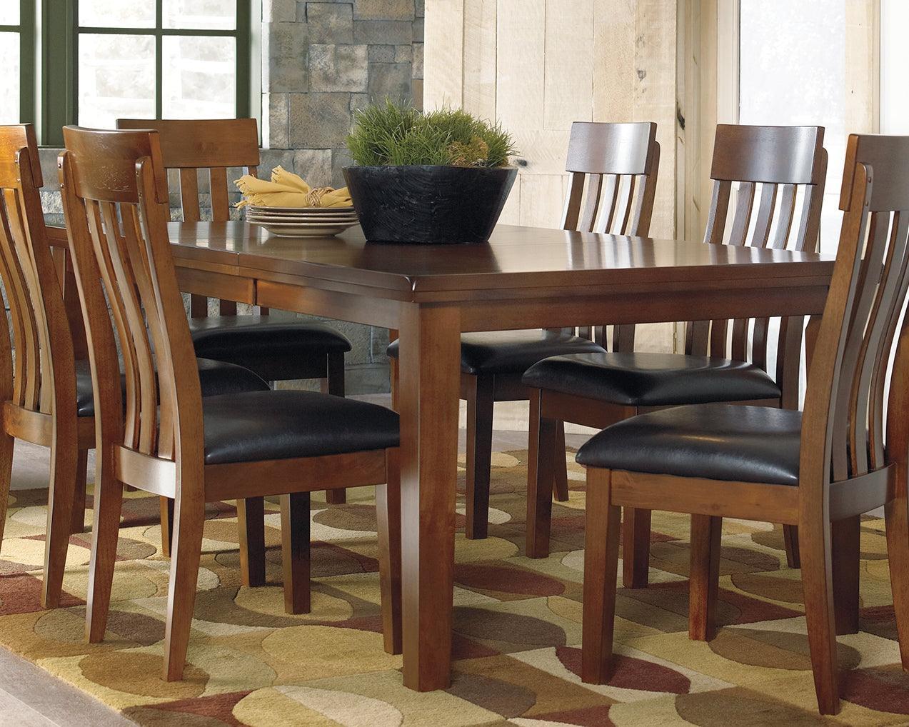 Side angle of Ralene Dining Extension Table showing butterfly leaf feature