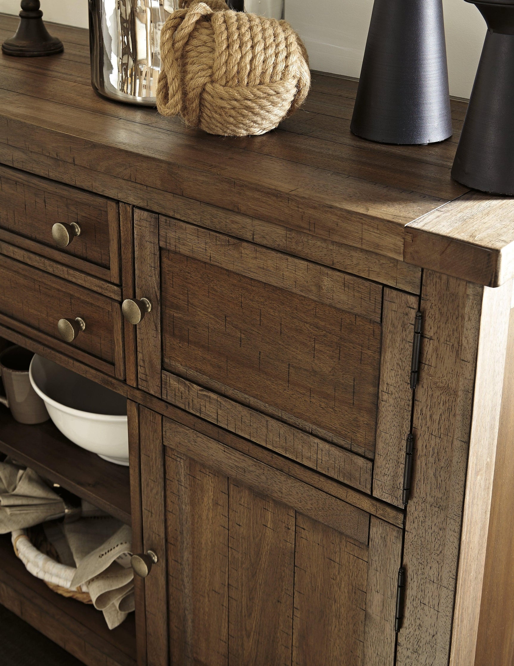 Close-up of Moriville Dining Server antiqued bronze-tone hardware