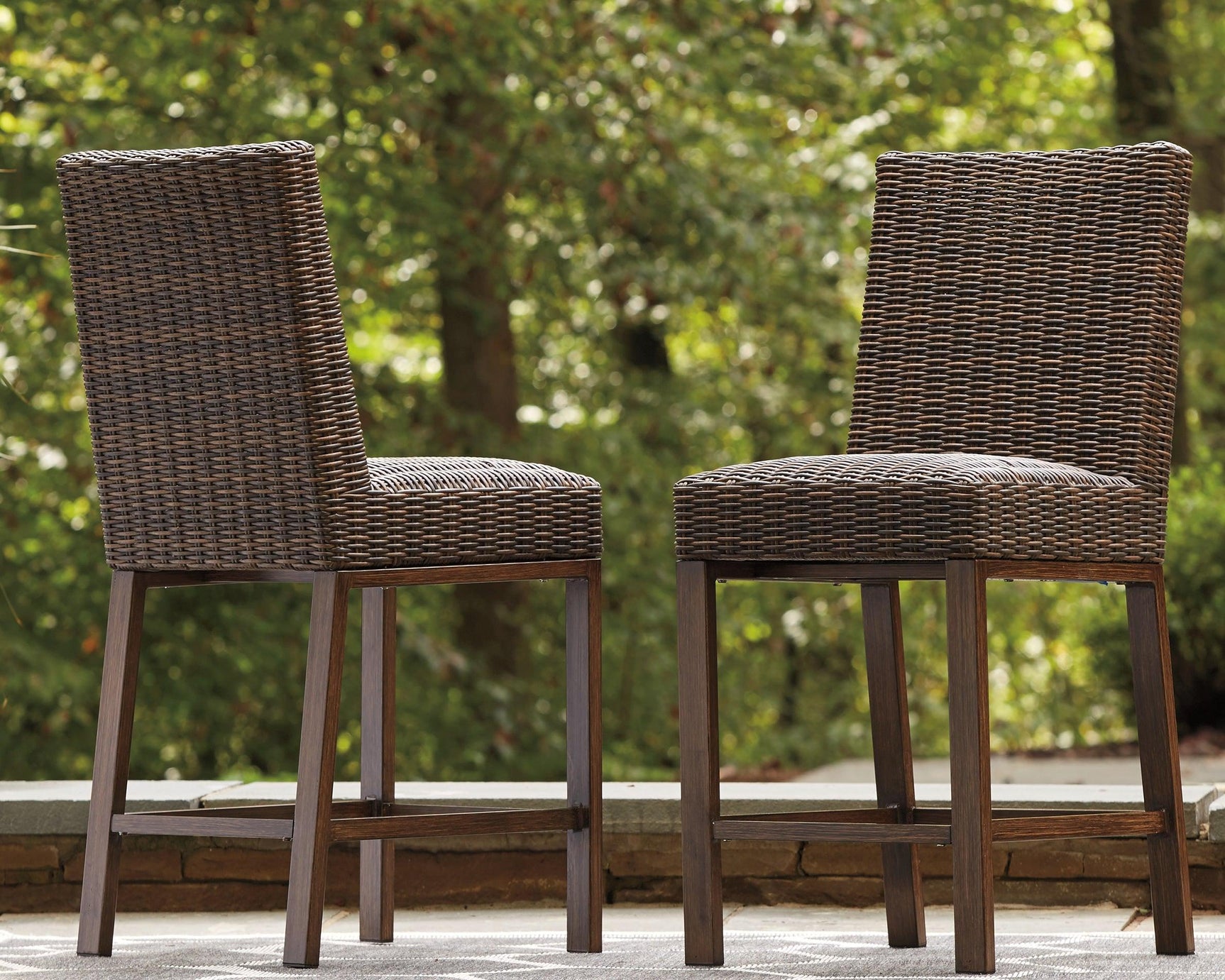 Close-up of woven resin wicker seat on Paradise Trail Bar Stool
