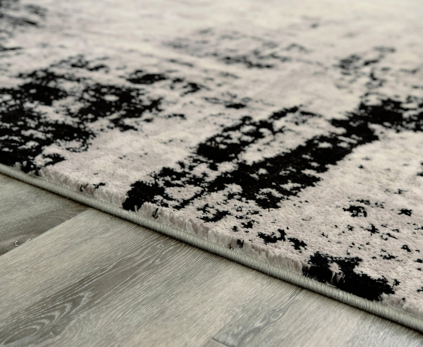 Zekeman Black/cream/gray 7'10" X 10' Rug - Ella Furniture