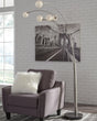 Winter Arc Floor Lamp with silver metal arc and black marble base, full view