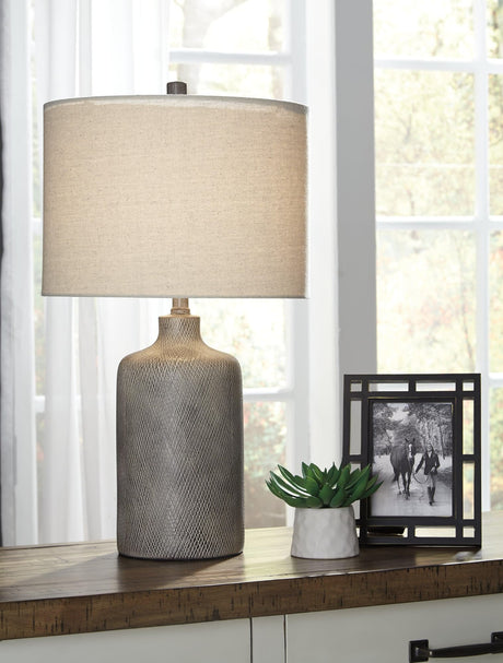 Front view of the Linus Antique Black Ceramic Table Lamp with white fabric drum shade