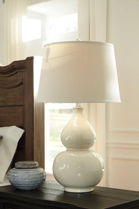 Front view of Saffi cream ceramic table lamp with crackle glaze base
