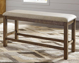 Moriville Beige Upholstered Counter Height Dining Bench front view showing cushioned seat and backrest