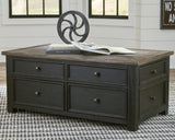 Tyler Creek coffee table with weathered grayish brown lift-top in open position
