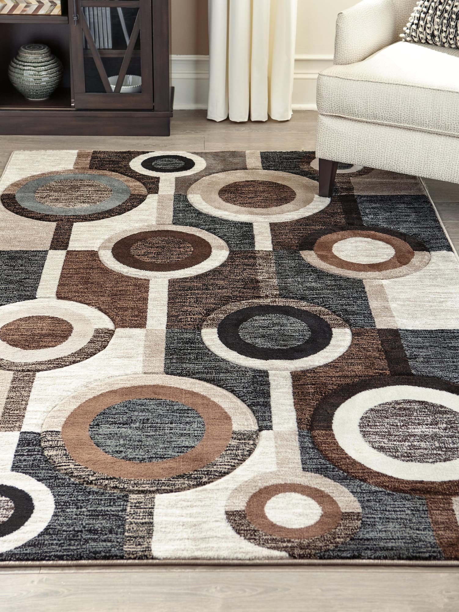 Guintte Multi 8'2" x 9'6" rug showing full rectangular geometric pattern in black, brown, and cream
