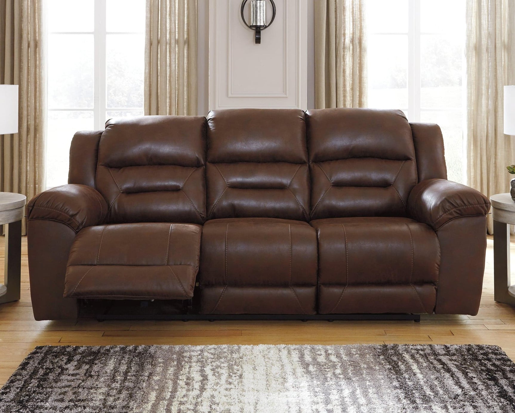 Stoneland Chocolate Faux Leather Power Reclining Sofa - Ella Furniture