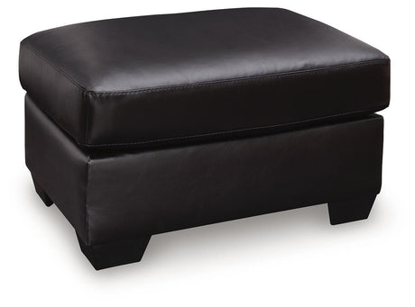 Glennbre Midnight Faux Leather Ottoman angled view
