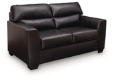 Glennbre Midnight Faux Leather Loveseat angled view