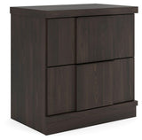 Shaehartin Dark Brown Nightstand angled view