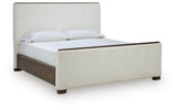 Radkin Burnished Brown King Upholstered Panel Bed angled view