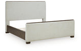 Radkin Burnished Brown King Upholstered Panel Bed angled view