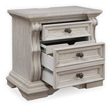 Bruchandi Antique White Upholstered Panel Bedroom Set angled view