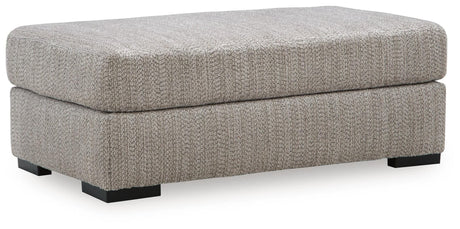 Lofwood Fossil Chenille Ottoman — angled view