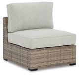 Calworth Beige Outdoor 9-Piece Sectional With Ottoman - Ella Furniture