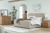 Dakmore Brown Upholstered Panel Bedroom Set King 3: Bed, Dresser, Mirror from Ella Furniture