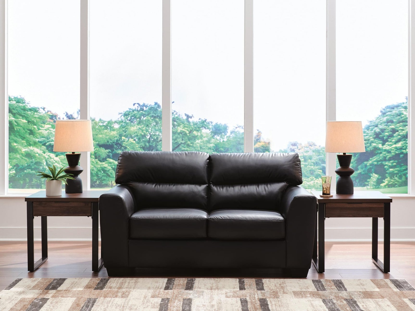 Glennbre Midnight Faux Leather Loveseat from Ella Furniture