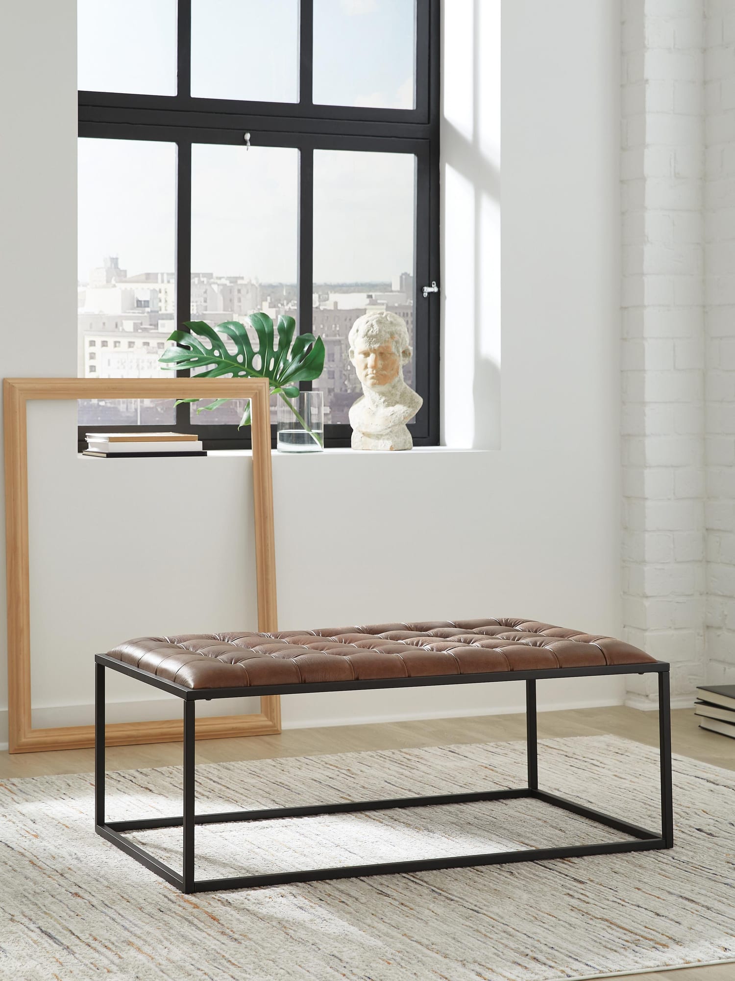 Junsor Brown/Black Coffee Table Ottoman from Ella Furniture