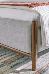 Lyncott Brown Upholstered 4-Piece Panel Bedroom Set King 3: Bed, Dresser, Mirror from Ella Furniture
