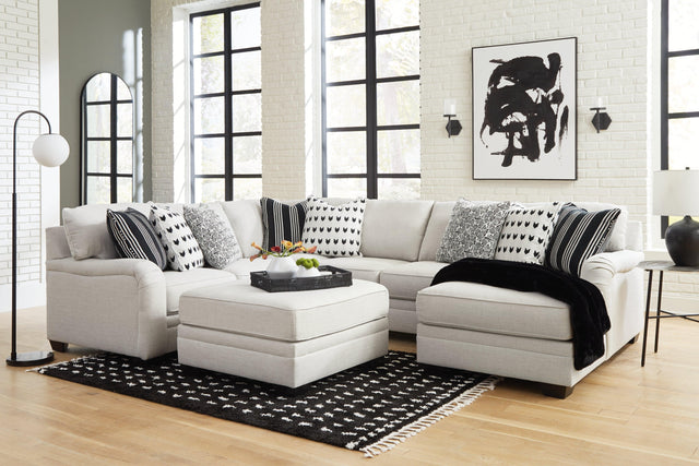 Huntsworth Dove Gray 4-Piece Sectional With Ottoman - Ella Furniture