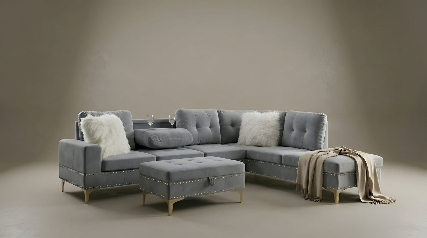 Joy II Grey Velvet Sectional with Gold Accents, Storage Ottoman, and Cupholder Table view 3
