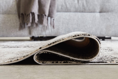 Langwell Black/Gray/White Large Rug - Ella Furniture
