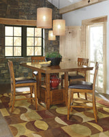 Ralene Medium Brown Counter Height Dining Table And 4 Barstools - Ella Furniture