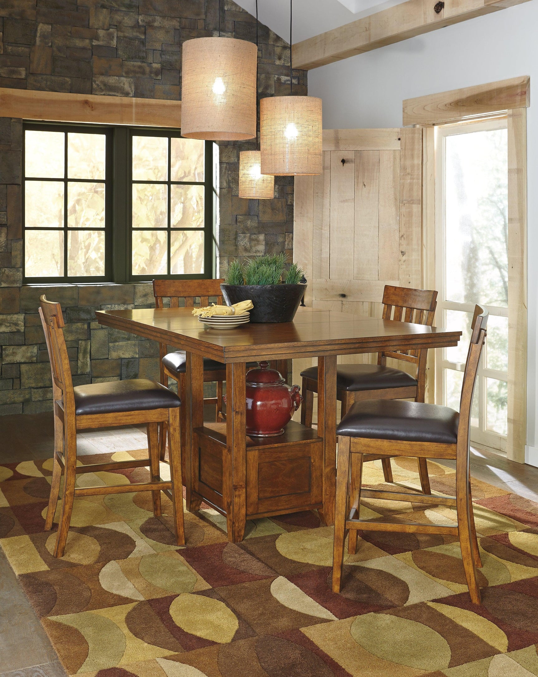 Ralene Medium Brown Counter Height Dining Table And 4 Barstools - Ella Furniture