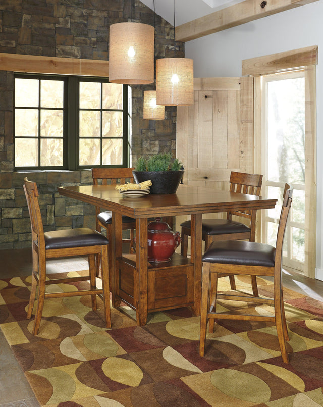 Ralene Medium Brown Counter Height Dining Table And 4 Barstools - Ella Furniture