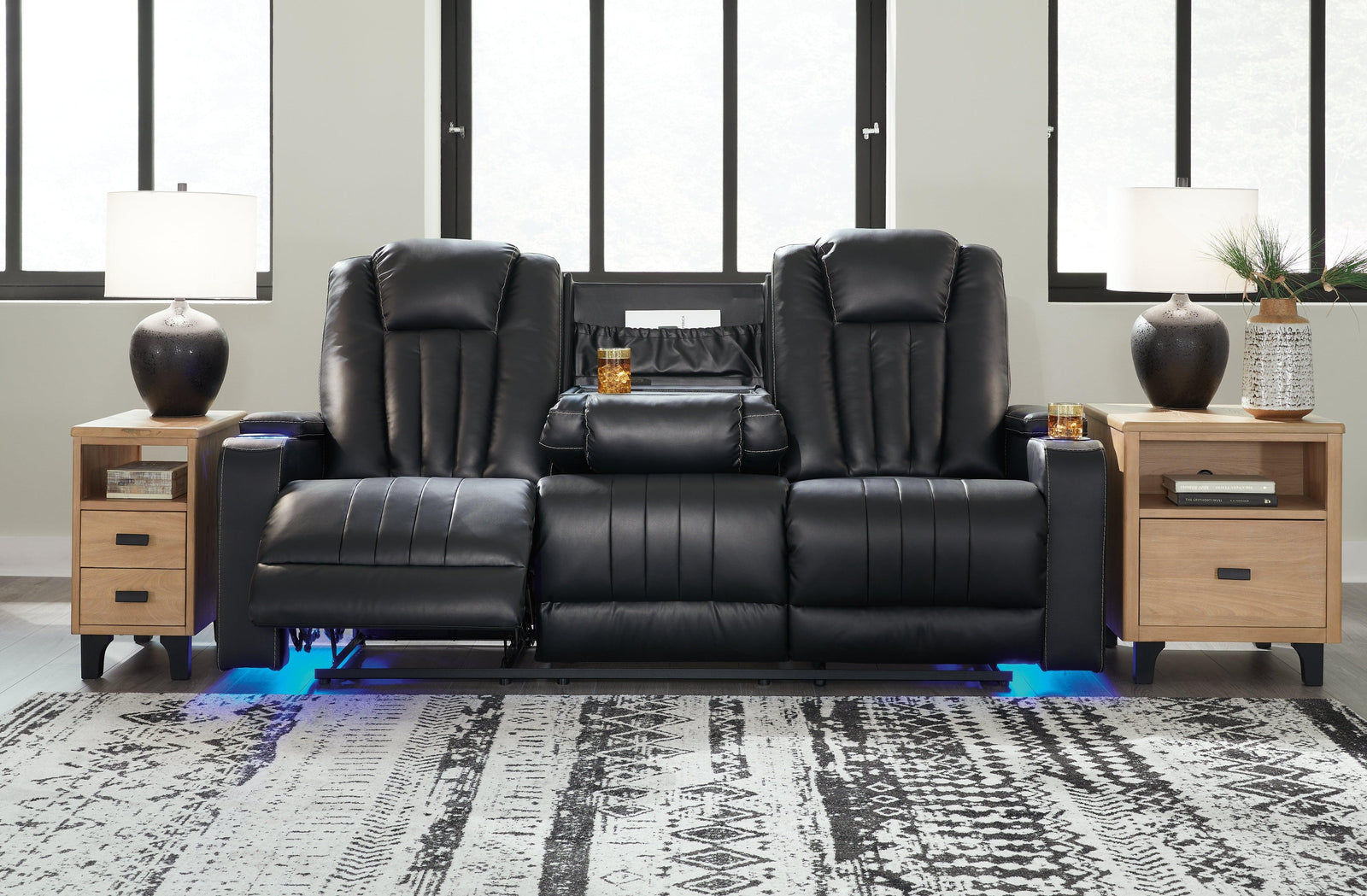 Center Point Black Faux Leather Reclining Sofa With Drop Down Table - Ella Furniture