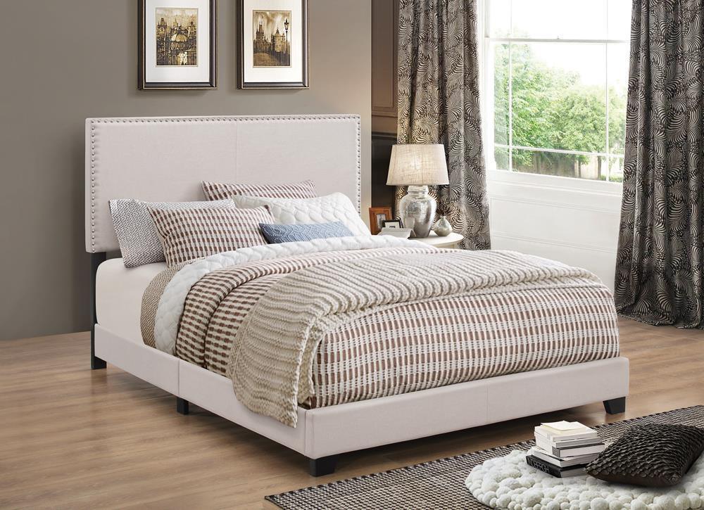 Boyd Eastern King Upholstered Bed With Nailhead Trim Ivory - Ella Furniture