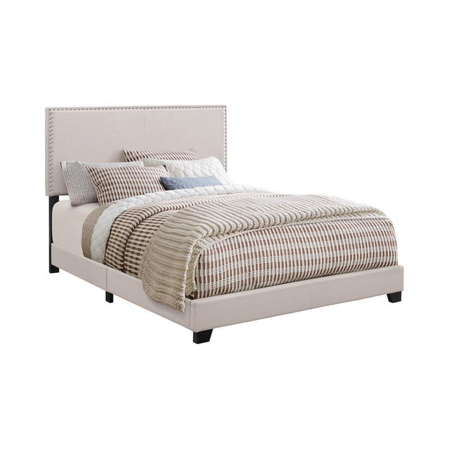 Boyd Eastern King Upholstered Bed With Nailhead Trim Ivory - Ella Furniture