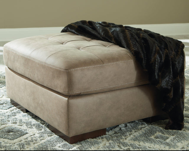 Maderla Pebble Faux Leather Oversized Accent Ottoman - Ella Furniture