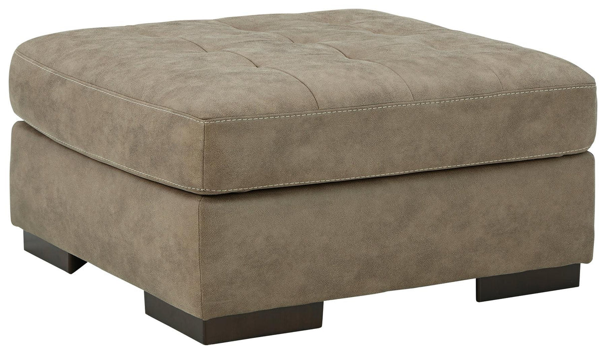 Maderla Pebble Faux Leather Oversized Accent Ottoman - Ella Furniture