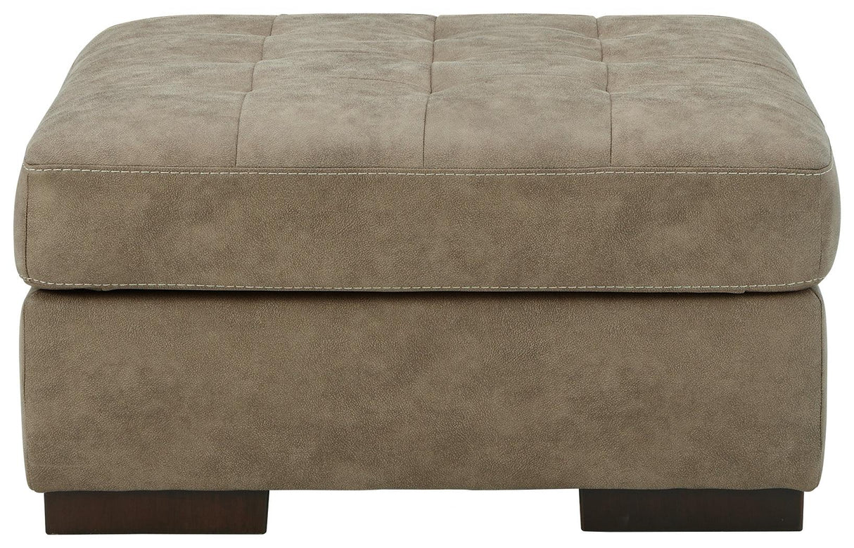 Maderla Pebble Faux Leather Oversized Accent Ottoman - Ella Furniture