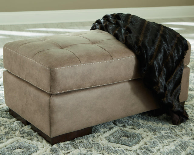 Maderla Pebble Faux Leather Ottoman - Ella Furniture