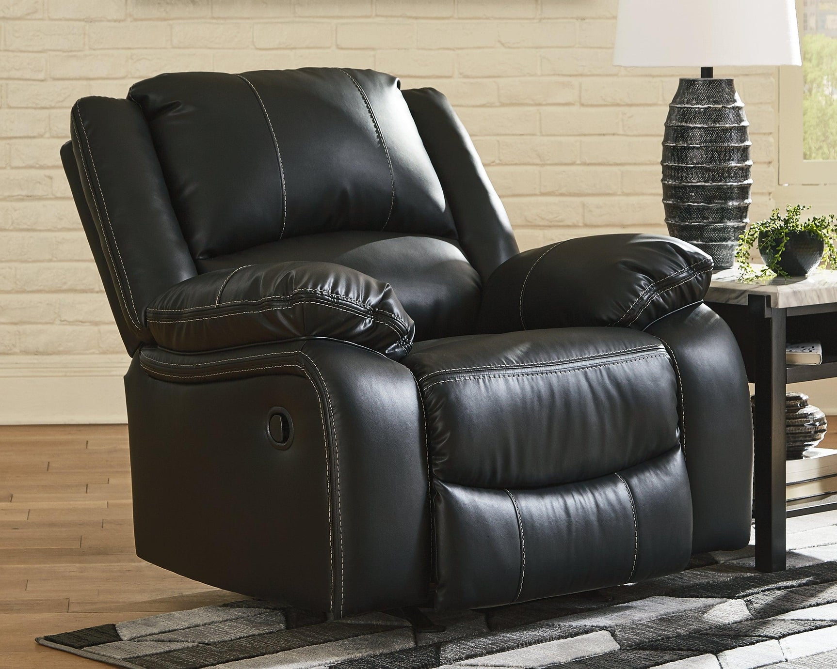 Calderwell Black Faux Leather Recliner - Ella Furniture