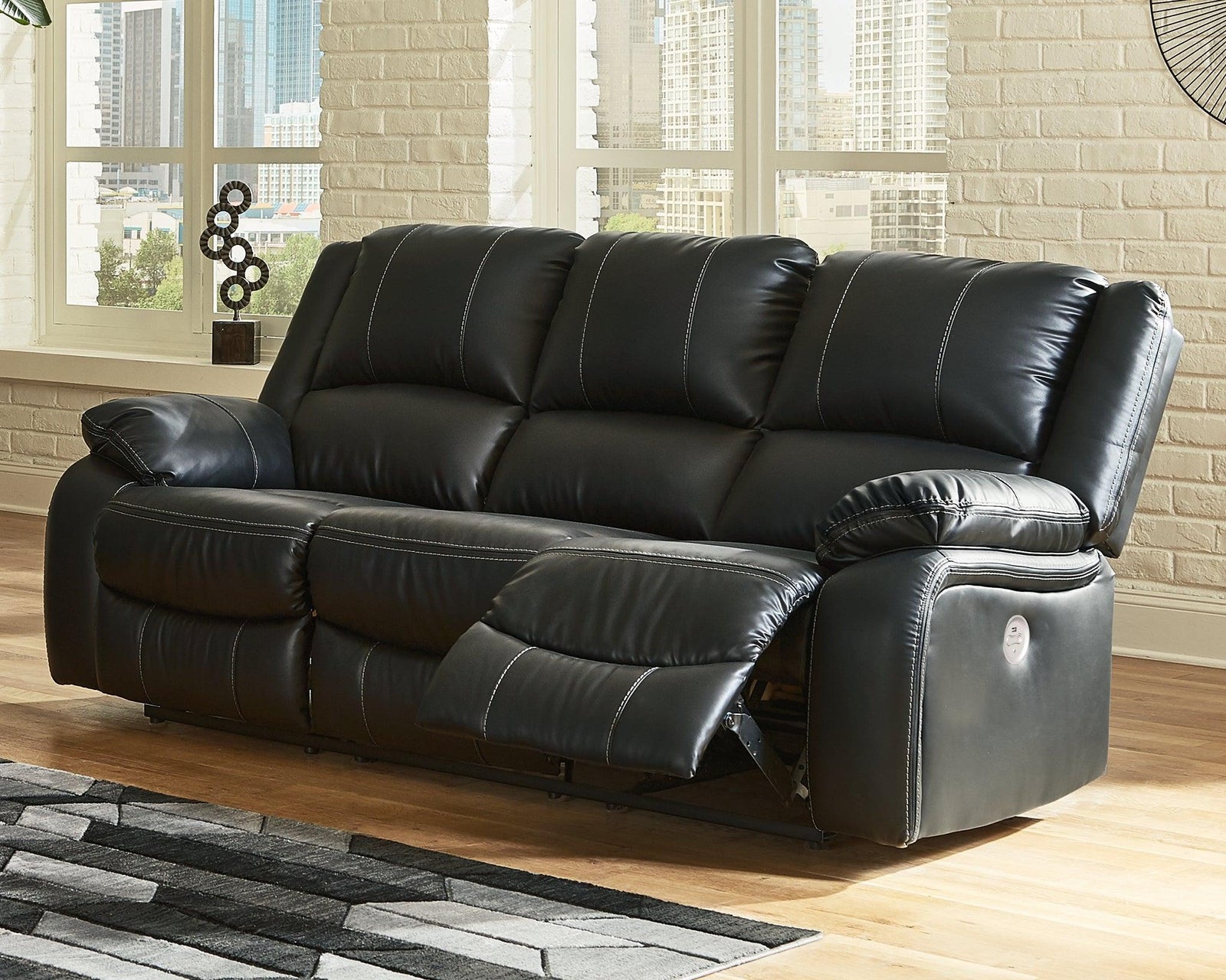 Calderwell Black Faux Leather Power Reclining Sofa