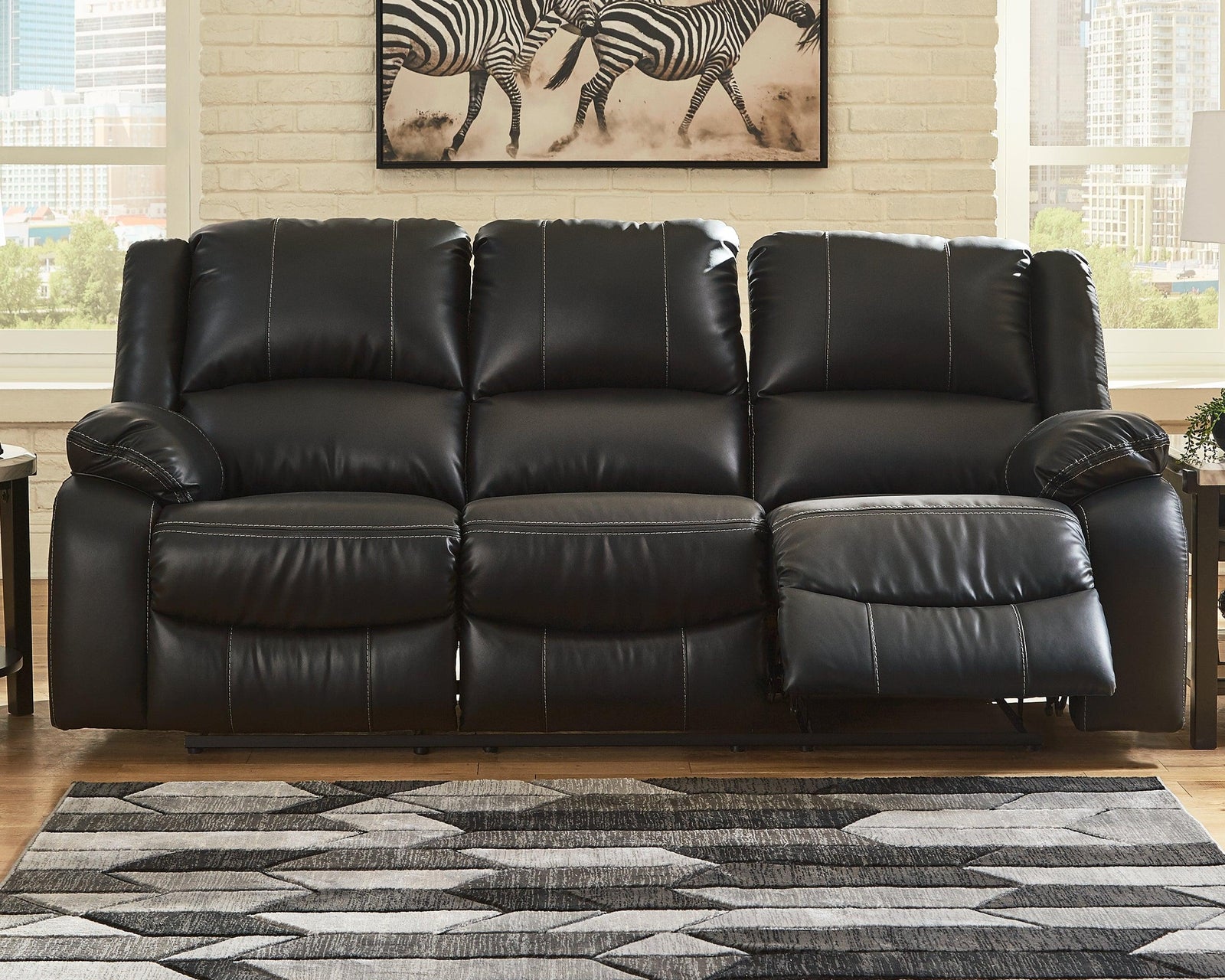Calderwell Black Faux Leather Reclining Sofa