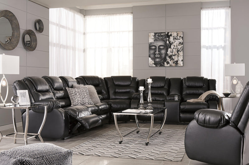 Vacherie Black Faux Leather Reclining Loveseat With Console - Ella Furniture
