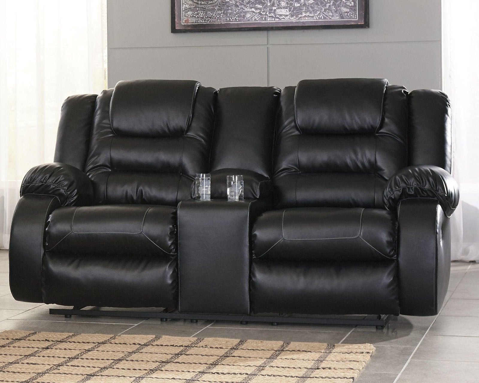 Vacherie Black Faux Leather Reclining Loveseat With Console - Ella Furniture