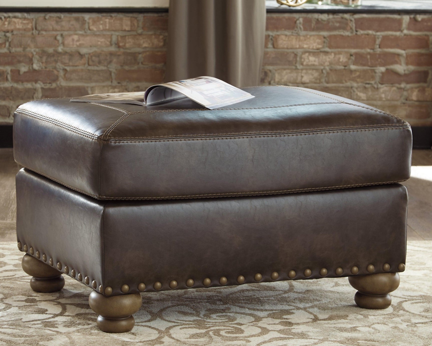 Nicorvo Coffee Faux Leather Ottoman - Ella Furniture