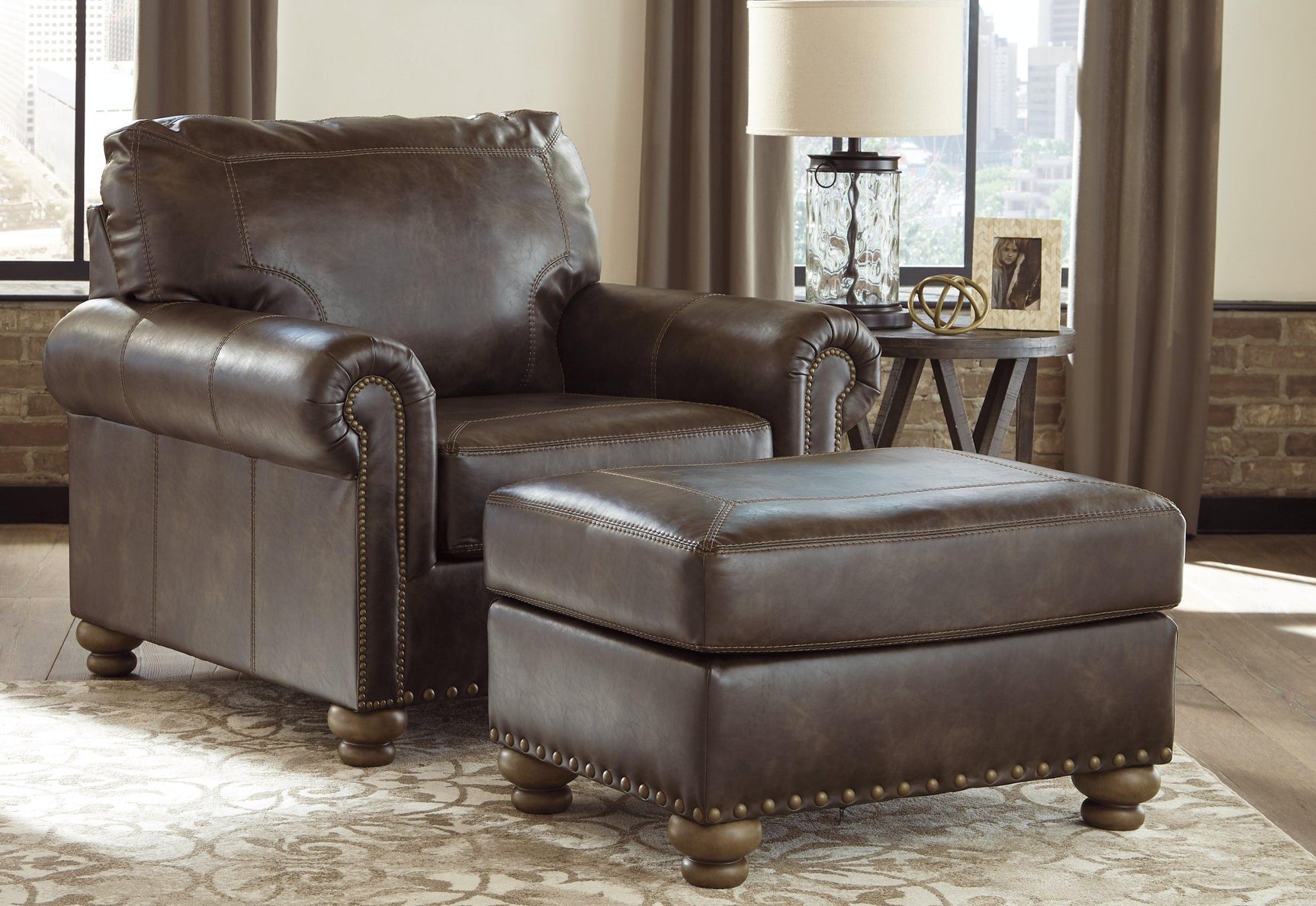 Nicorvo Coffee Faux Leather Ottoman - Ella Furniture