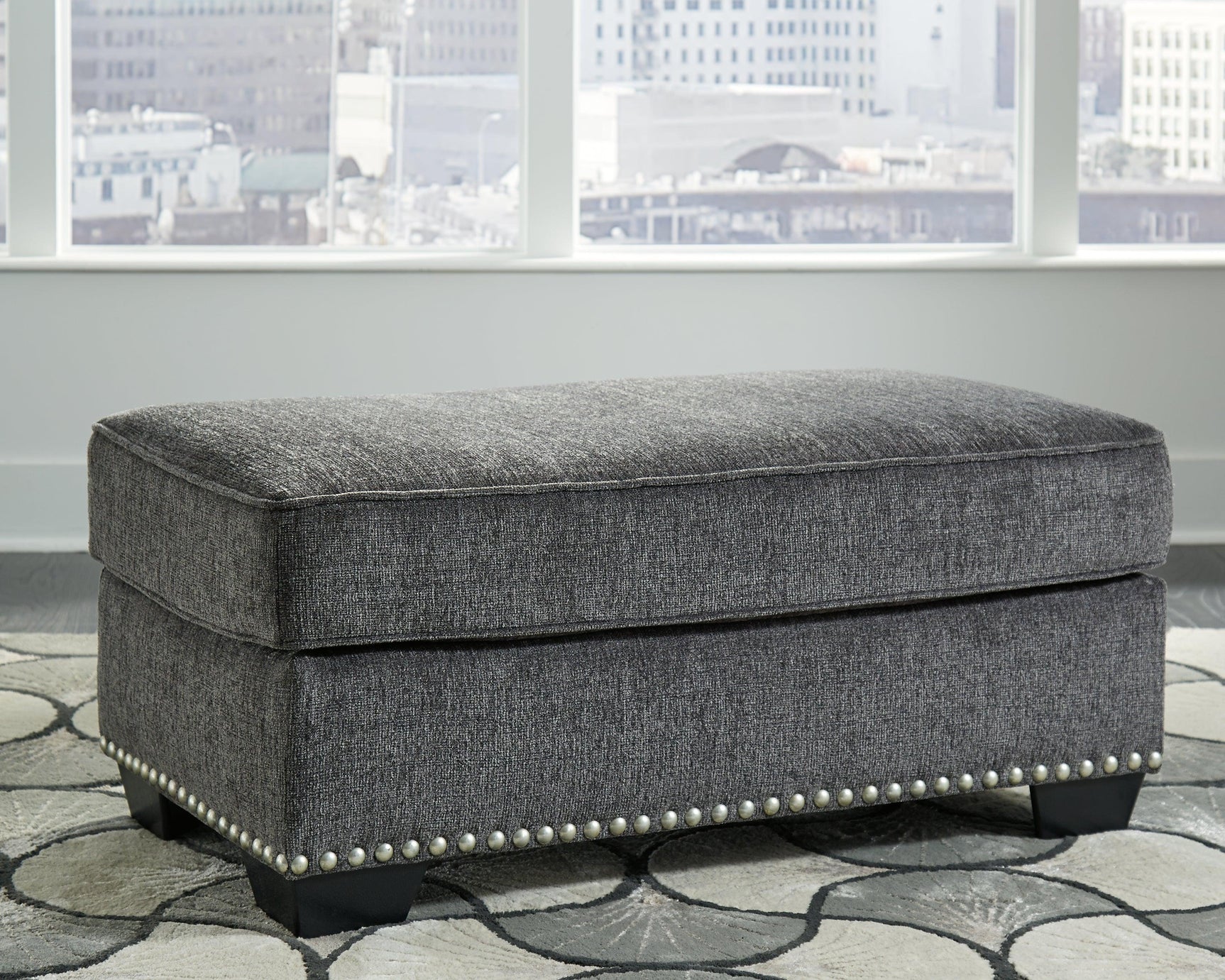 Locklin Carbon Chenille Ottoman - Ella Furniture